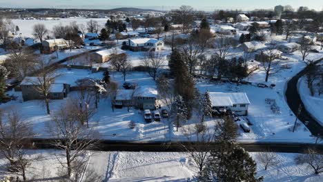 Snow-covered-homes-and-buildings-in-suburbia-of-american-town-in-winter-snow