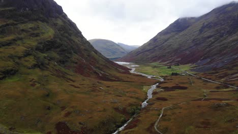 Aerial-View-Of-Dramatic-Glencoe-Landscape-In-Scotland-With-River-Coe-Flowing-In-The-Middle