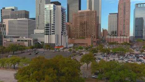 Ascending-drone-shot-of-skyscrapers-and-the-downtown-Houston-area