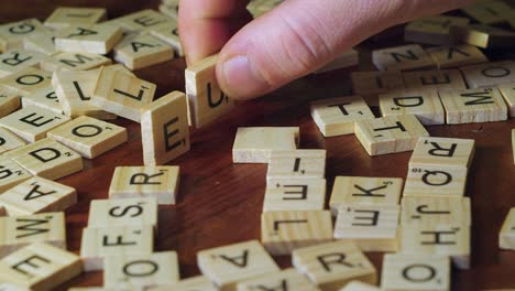 Word-DOLLAR-in-Scrabble-tile-letters-knocked-over,-replaced-by-EURO