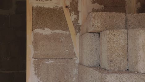 Hempcrete-bricks-and-wall-interior-in-a-construction-site,-panning-left-to-right
