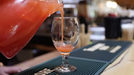 A-glass-of-limonade-being-poured-at-the-restaurant-bar