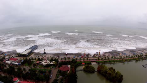 Like-drone-shot-of-windy-day-on-black-sea-big-waves-destroying-coast-of-Batumi