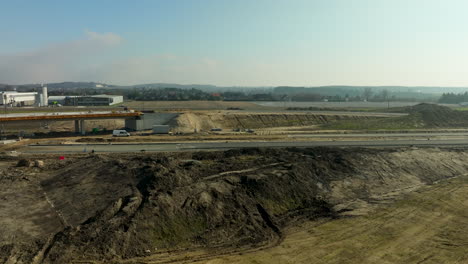 Expansive-view-of-ongoing-highway-construction-and-surrounding-landscape