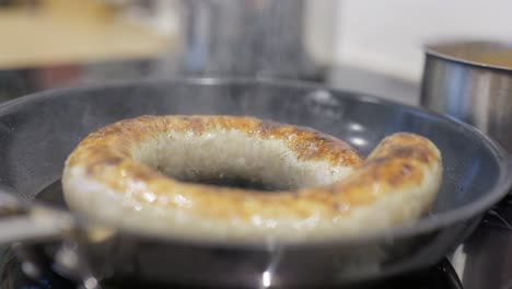 Medister-sausage-fried-in-a-pan-at-a-high-temperature