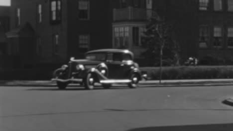 Buick-McLaughlin-Series-60-Car-Drives-Down-a-Neighborhood-in-New-York-1930s