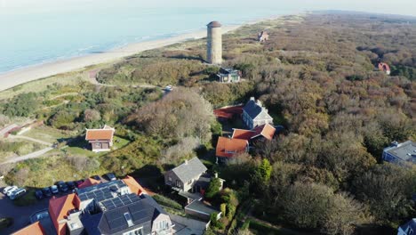 Cinematic-aerial-shot-of-a-tower-in-Domburg,-zeeland