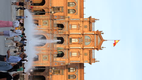 Vertical-View-Of-People-At-The-Front-Of-Plaza-de-España-Historical-Landmark-In-Seville,-Spain