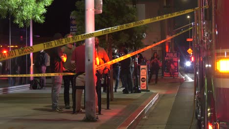 Firefighters-stage-with-caution-tape-in-front-of-building