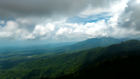 Timelapse-of-abstract-white-clouds-moving-over-Bali-jungle-and-mountains,-Indonesia