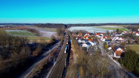 Wintertime-Rail-Commute-Beside-a-Sleepy-Village