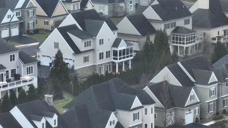 Aerial-descending-shot-of-large-American-neighborhood