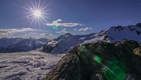 Sunset-sunrise-over-tall-mountains-covered-in-snow-layer-time-lapse-nature