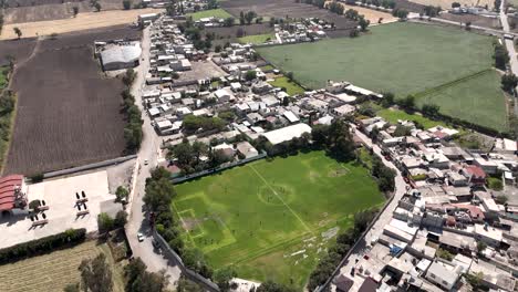Drone-perspective-captures-expanse-of-Tepatepec-Hidalgo-region,-including-its-soccer-field