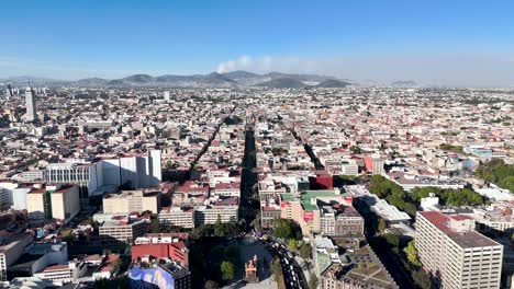 Backwards-drone-shot-of-mexico-city-downtown