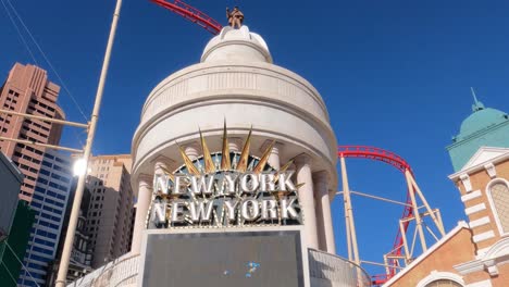 Las-Vegas-Nevada-USA,-New-York-New-York-Hotel-and-Casino-Logo,-Pedestrian-Bridge-Entrance-Under-Rollercoaster