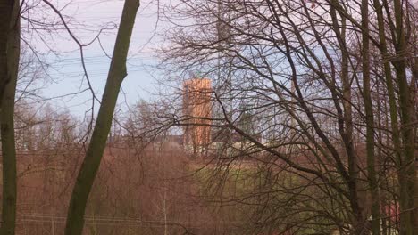 A-view-through-the-bare-branches-to-the-dominant-coal-mine-in-the-landscape