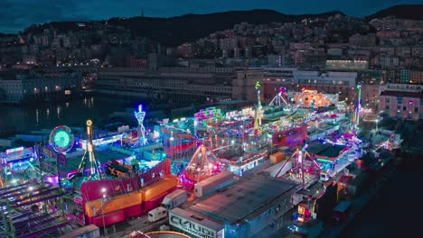 Night-aerial-view-over-Luna-Park-with-colorful-neon-lights-at-Ponte-Parodi