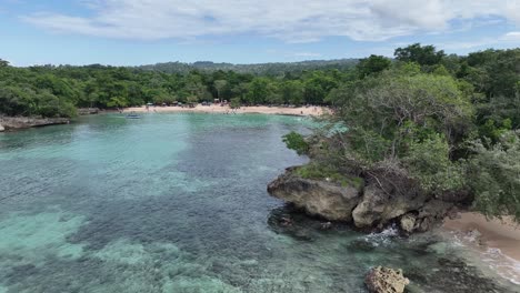 Aerial-view-of-people-at-the-Playa-Caletón-beach-in-Rio-San-Juan,-Dominican-republic