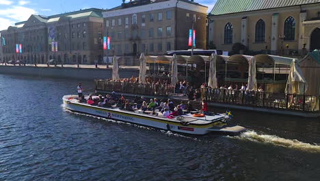 Gothenburg,-Sweden,-People-in-Tourist-Boat-Sailing-in-Canal-on-Sightseeing-Tour