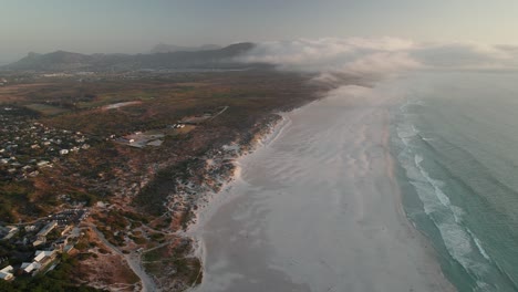 Aerial-View-Over-Noordhoek-At-Sunset-In-Cape-Town,-South-Africa---Drone-Shot