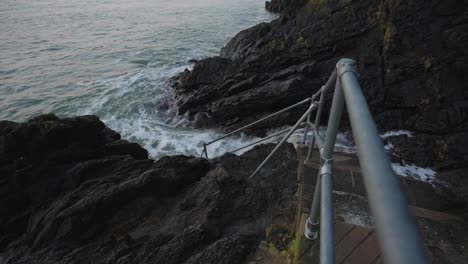 Sea-water-clashing-on-rocks-and-staircase