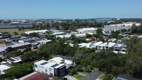 Aerial-Vista:-Leafy-East-Brisbane-Suburb-with-River,-Bridge-and-Airport