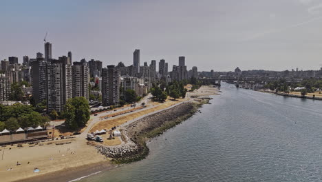 Vancouver-BC-Canada-Aerial-v118-drone-flyover-False-Creek-capturing-views-of-English-Bay-Beach,-Sunset-Beach-Park-in-the-West-End,-and-the-downtown-cityscape---Shot-with-Mavic-3-Pro-Cine---July-2023