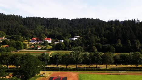 Experience-the-dynamic-spirit-of-Freiburg-im-Breisgau-from-above,-where-drone-footage-reveals-not-only-its-historic-landmarks-but-also-the-sprawling-green-spaces-dotted-with-soccer-fields