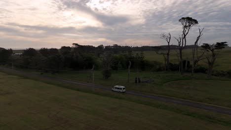 Parallax-drone-shot-of-Van-driving-on-the-New-Zealand-country-side