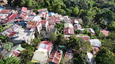 Aerial-birds-eye-shot-of-poor-Neighborhood-with-rusty-roof-in-tropical-suburb-of-Dominican-Republic