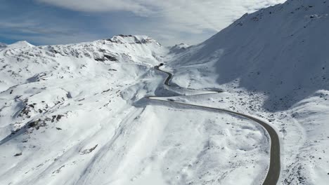 Grossglockner-High-Alpine-Road-and-Mountain-Pass-at-Snowy-Alps-in-Austria---Aerial-4k