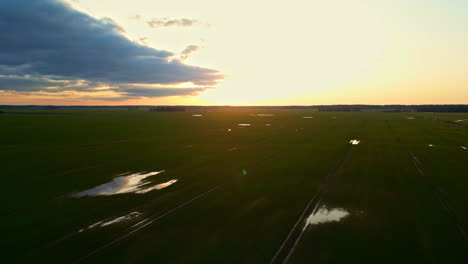 Panoramic-View-Of-Fields-And-Wetlands-During-Sunset