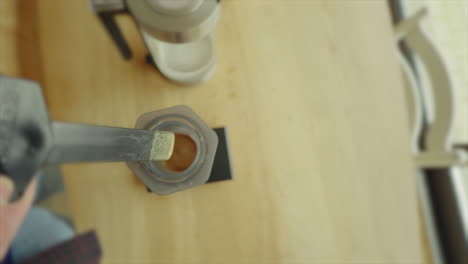 Unique-top-down-Snorri-Cam-view-of-a-dynamic-scene-of-a-home-barista-preparing-his-morning-brew