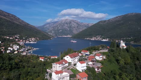 Aerial-View-of-Kotor-Bay,-Kamenari-Ferry-Port-and-Coastal-Villages,-Montenegro