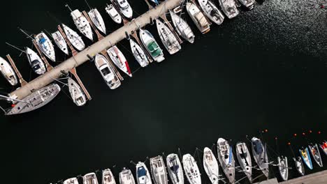 many-small-boats-in-the-harbor,-top-shot,-baltic-sea,-warnemünde,-drone