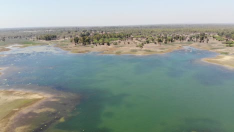 Aerial-shot-of-beautiful-blue-water-lake-in-Lakshanpur-dam-in-Chatra,-Jharkhand,-India