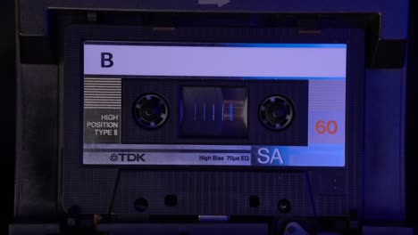 Placing-and-Playing-Audio-Cassette-Tape-Recording-in-Deck-Player,-Side-B,-Close-Up