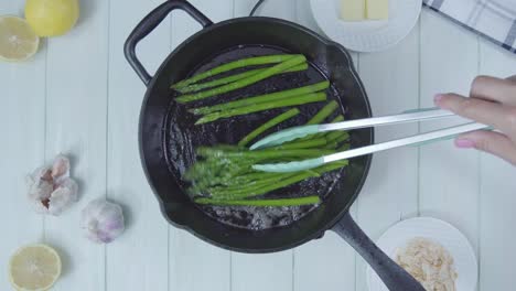 top-down-view-of-Green-asparagus-cocked-in-olive-oil-pan-organic-healthy-vegan-vegetarian-plant-based-food-diet