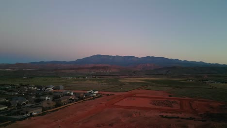 Fields-And-Mountains-Surrounding-Hurricane-City-In-Utah---Aerial-Drone-Shot