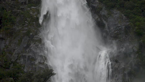 Slow-Motion-static-footage-of-the-bottom-of-a-waterfall-in-Milford-Sound---Piopiotahi,-New-Zealand