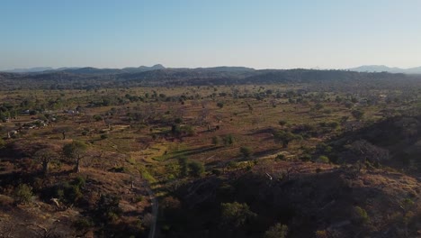 Flying-over-the-Malawi-sabana,-in-Monkey-beach,-Malawi,-Africa