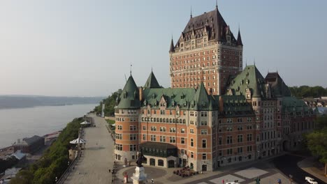 aerial-footage-of-Château-Frontenac-most-famous-landmark-Quebec-City-old-town-Canada,-drone-close-up-of-old-colonial-style-architecture-building