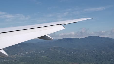 Extended-Flaps-on-Aircraft-Wing-Preparing-for-Landing,-View-from-Cabin