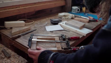 Man-Building-Wood-Frame---Tools-And-Woods-On-The-Table---Close-Up