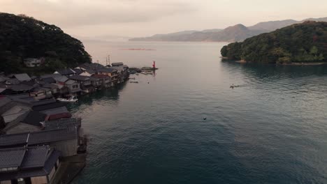 Kyōtango-Sunset-landscape-aerial-Japanese-drone-peninsula-beach-travel-sea-waves-blue-turquoise-fire-golden-skyline,-boat-houses
