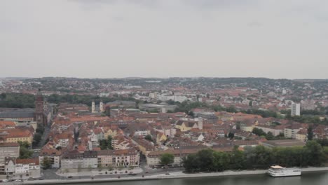 Bamberg-with-river-and-old-architecture,-overcast-day,-panning-shot,-aerial-view