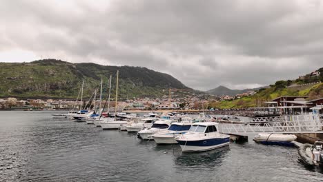 Panorama-of-Machico-bay-on-cloudy-morning,-Slow-motion-Madeira-Island