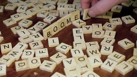 Scrabble-tile-letters-on-edge-form-word-BOOMERS,-for-baby-boomer-gen