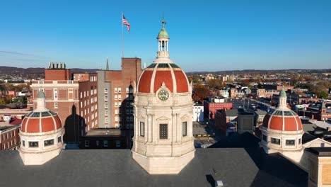 York,-Pennsylvania-county-government-building-with-domes-and-American-flag-in-background